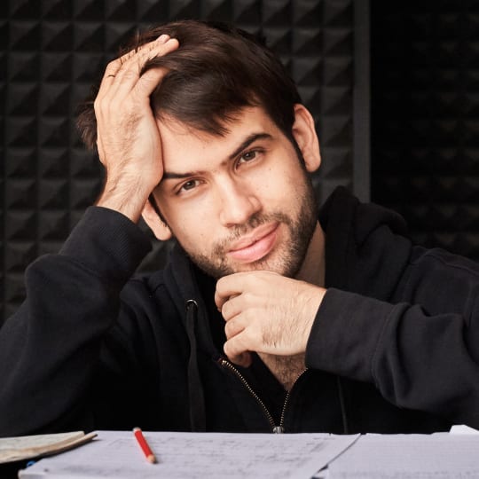 Jean-S&eacute;lim Abdelmoula, pianist, leaning on piano