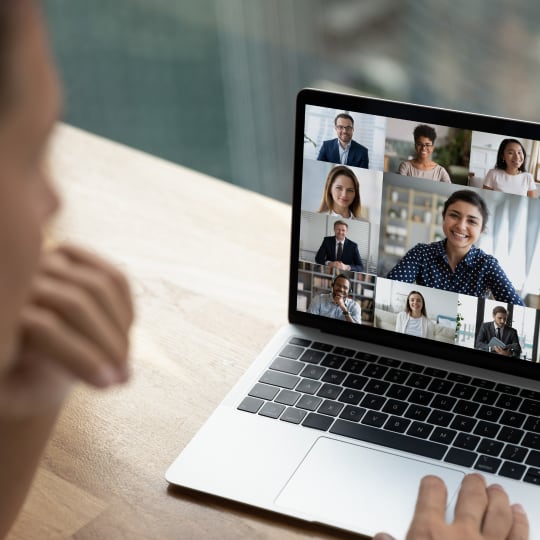 Person sitting at laptop on video call